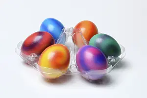 Christian Tradition Drucke: Coloured eggs in plastic packaging