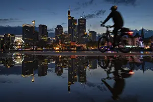 Frankfurt Mainfest Drucke: The colourful lights of the Mainfest are reflected in a puddle