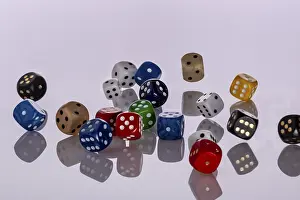 Deserted Scene Drucke: Many colourful playing cubes fall jumbled on a bright surface
