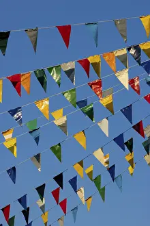 Nice Weather German Federal Republic Drucke: Colourful triangular flags on a rope in the air and a blue sky in the background