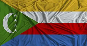 Drucke von Die Flagge der Komoren auf einem Stofftexturboden. Nationalflagge der Inselrepublik Komoren, ein Symbol für Einheit und Identität Komoren Drucke: Die Nationalflagge der Komoren auf einem Stofftexturhintergrund.
