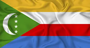 Drucke von Die Flagge der Komoren weht im Wind, ihre Farben leuchten in der Sonne Komoren Drucke: Flagge der Komoren mit Texturen, die im Wind flattern.