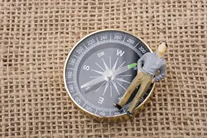 Deserted Landscape With Compass Drucke: The compass instrument placed on linen canvas