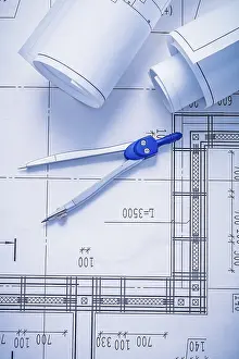 Rolled Blueprints Drucke: Compass and two rolled up white blueprints