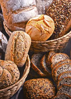Grocery Store Selection Drucke: Composition with assorted bakery products in wicker basket