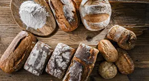 Bakery Product Arrangement Drucke: Composition with assorted bakery products on wooden table