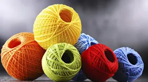 Handicraft Supplies Drucke: Composition with assortment of different colored yarns and hook for crocheting