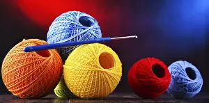 Handicraft Supplies Drucke: Composition with assortment of different colored yarns and hook for crocheting