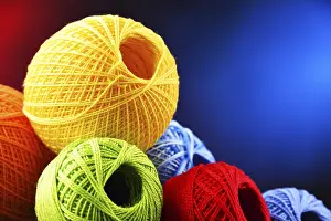 Handicraft Supplies Drucke: Composition with assortment of different colored yarns and hook for crocheting