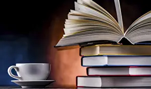 University College Scene Drucke: A composition with books and a cup of coffee