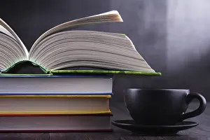 Educational Institution Decor Drucke: Composition with books and cup of coffee on the table