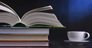 Composition With Books Drucke: Composition with books and cup of coffee on the table