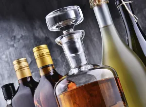 Alcoholic Beverage Composition Drucke: Composition with carafe and bottles of assorted alcoholic beverages