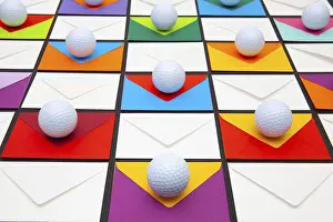 Colorful Office Supplies Drucke: Composition with colored envelopes and golf balls on the table