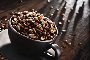 Caffeine Rich Food Image Drucke: Composition with cup of coffee and beans