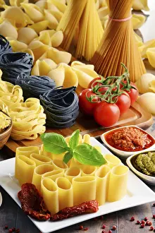 Mediterranean Food Photography Drucke: Composition with different sorts of pasta on kitchen table