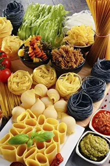Kitchen Table Setup Drucke: Composition with different sorts of pasta on kitchen table