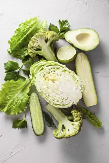 Fresh Green Vegetables Drucke: Composition of fresh green cut in half vegetables on a white background