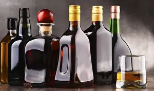 Assorted Alcoholic Beverages Drucke: Composition with glass and bottles of assorted alcoholic beverages