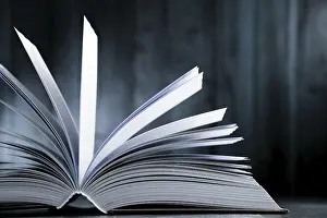 Deserted Library Scene Drucke: Composition with hardcover book on the table