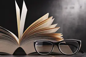 Educational Institution Art Print Drucke: Composition with open book and glasses on the table