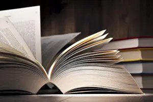 Deserted Library Scene Drucke: Composition with open book on the table