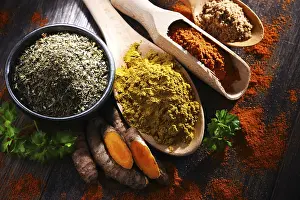 Kitchen Table Setup Drucke: Composition with spices on wooden kitchen table