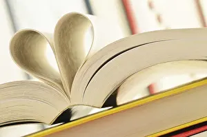 Educational System Symbolism Drucke: Composition with stack of books and pages formed in a shape of heart