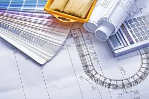 Close Up Construction Tools Drucke: Composition of tools stack rolled up white blueprints calculator paintbrushes in paint can
