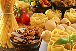 Kitchen Table Setup Drucke: Composition with variety of pasta on kitchen table