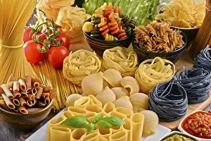 Kitchen Table Setup Drucke: Composition with variety of pasta on kitchen table