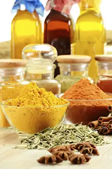 Kitchen Table Setup Drucke: Composition with variety of spices on kitchen table