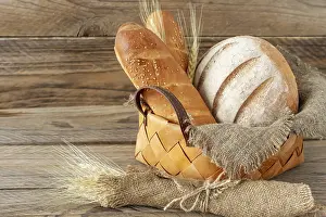 Rustic Baked Goods Drucke: Composition of various baked products in basket on rustic background