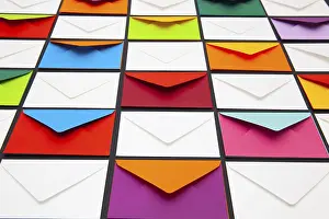Colourful Desk Supplies Drucke: Composition with white and colored envelopes on the table
