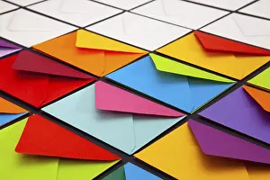 Multicolored Writing Utensils Drucke: Composition with white and colored envelopes on the table