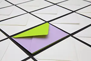 Composition with white and colored envelopes on the table