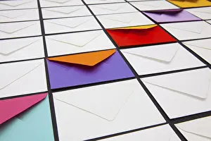 Composition with white and colored envelopes on the table