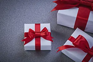 Christmas Gift Collection Drucke: Composition of wrapped gift boxes on grey surface Holiday concept