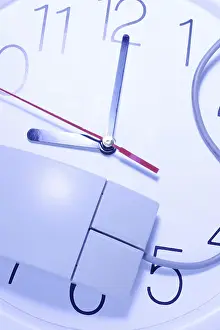 Studio Shot Symbolic Picture Drucke: Computer mouse on clock