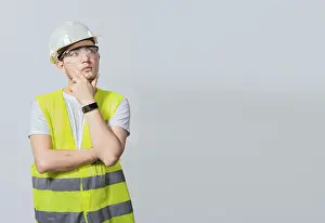 Young Construction Worker Drucke: Concept of a meditative engineer solated