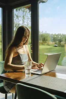 Remote Work Concept Drucke: Concept of remote work, workspace tranquility and technology use in natural settings
