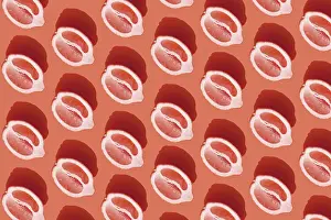 Healthy Eating Concept Drucke: Conceptual pattern with halves of lemon with shadow on red background