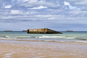 Normandy Beach Drucke: Concrete boxes as artificial breakwaters on the sandy beach