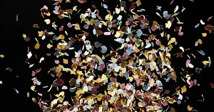 New Year Celebration Images Drucke: Confettis Falling against Black Background