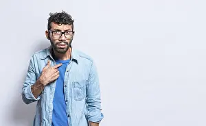 Isolated Person Drucke: Confused man pointing at himself