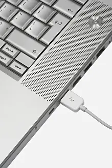 White Studio Background Photo Drucke: Connection to modern notebook on a white background