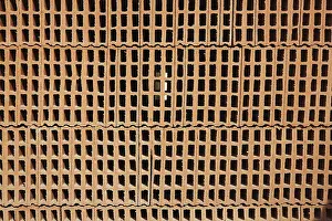 Empty Construction Yard Drucke: Construction bricks stacked red clay brick