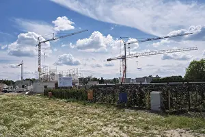 Central Europe Urban Environment Drucke: Construction cranes in a new development area