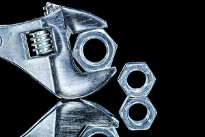 Black Background Detail Drucke: Construction nuts adjustable spanners on black background