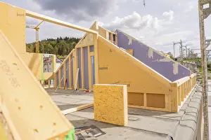 Construction Site In Southern Germany Drucke: Construction of a timber house in the shell phase on a construction site